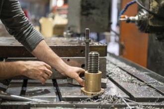 Professional metalworker at the manufacture workshop. graphy
