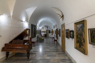 Bojnice, Slovakia, 26 September, 2022: corridor with paintings and musical instruments inside the