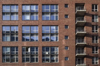 House facade in hamburg's Speicherstadt - reflection in the windows of the elbphilharmonie concert