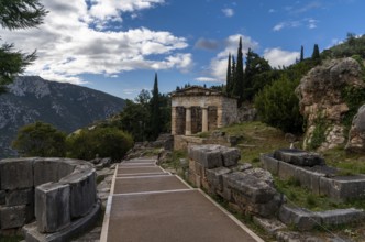 Delphi, Greece, 7 November, 2022: view of the Ahtenian Treasury in the Sanctuary Athena Pronaia in
