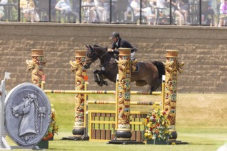 Kyle King of the United States and riding Odysseus, compete in the 1.60m Grand Prix during The