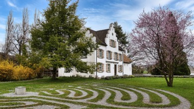 View of the priest's house on the island of Werd with the labyrinth in the foreground