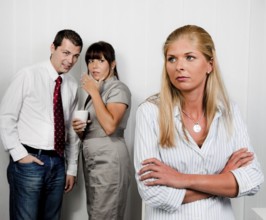 Workplace bullying in an office. Gossip in the office Austria