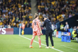 BRISBANE, AUSTRALIA, JULY 27: Tony Gustavsson, head coach of Australia and Mackenzie ARNOLD of