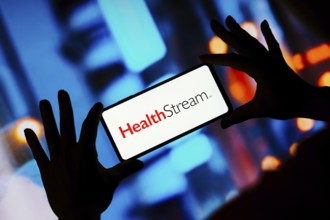In this photo illustration, the HealthStream logo seen displayed on a smartphone