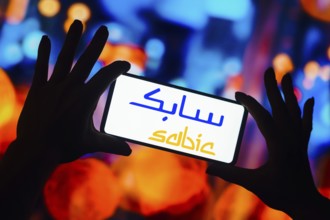 In this photo illustration, the SABIC logo is displayed on a smartphone screen
