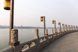 Lamps along a lakeside promenade in Beihai Park, Beijing, China in March 2018, Beijing, China, Asia