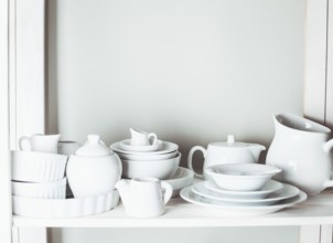 Shelves in the rack in the kitchen at shabby chic style