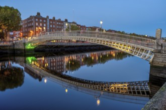 The famous Ha'penny Bridge in Dublin, Ireland, at night, Europe