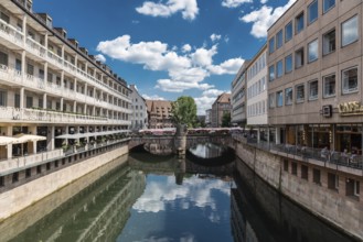 Germany, 07 26 2018: Historical buildings reflecting at the banks of the river Pegnitz, Europe