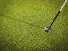 Detail Of A Hole On A Golf Course With Pole And Copy Space