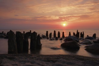 Remains of the groyne in the light of the setting sun