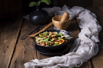 Pasta salad with green asparagus, olives and Parma ham
