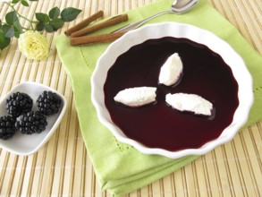 Sweet blackberry soup with quark dumplings