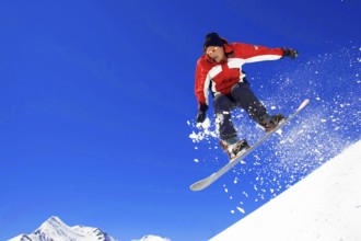 Skiers in action, descent on a slope, deep snow