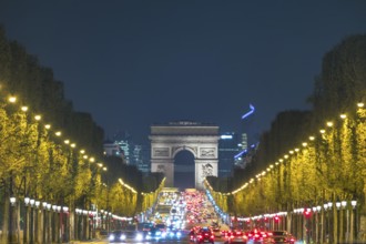 Paris France night city skyline at Arc de Triomphe and Champs Elysees
