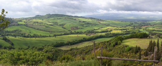 Tuscany panorama landscape with farmland hill fields in Italy