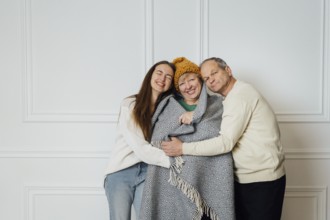 Close up portrait of family with elderly mature woman, man and millennial daughter.