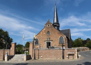 Lennik, Flemish Brabant Region, Belgium, 07 20 2021 Exterior of a traditional brick stone catholic