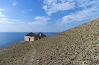 Old ruined house on the hillside above the sea. Crimea, Cape Meganom