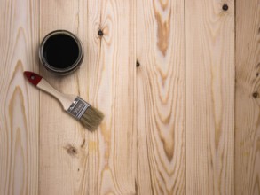 Stain and brush on wooden backdrop