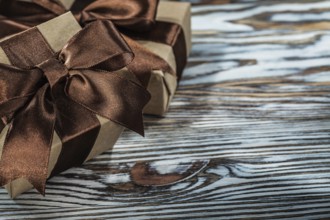 Composition of brown present boxes on wooden background