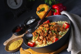 Rustic Wulgur pans with gratinated gyros and yoghurt