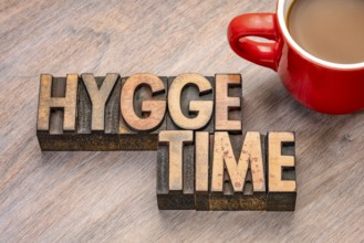 Hygge time word abstract in vintage letterpress wood type blocks, Danish lifestyle concept