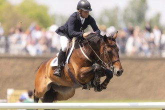 Will Simpson of the United States and riding Imar, compete in the 1.60m Grand Prix during The