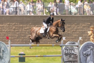 Tiffany Foster of Canada and riding Electrique, compete in the 1.60m Grand Prix during The