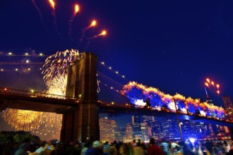 July 4th 2014 fireworks at Brooklyn bridge Manhattan skyline New York USA