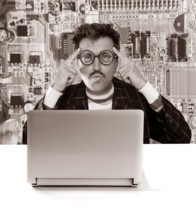 Nerd pensive man with myopic glasses looking for solution on electronics technology problem