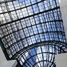 View of skyscrapers through the glass ceiling of the World Financial Centre in New York, NY, USA,