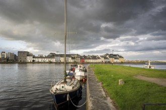 Boat anchored in Eglinton Canal Sea Lock, The Long Walk, Galway, Ireland, United Kingdom, Europe