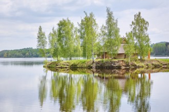 Small Island with a House among Birches in the Middle of the Daugava River, Latvia Plavinas,