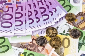 Many euro banknotes of the European Union. Lying next to each other Austria