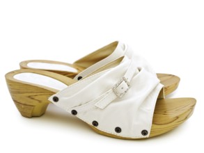 Woman's summer white shoes over white background