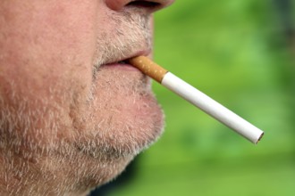 Man with a cigarette in his mouth