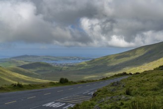 The steep and winding mountain road leading to the top of Connor Pass on the Dingle Peninsula