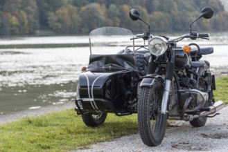 Motorbike with sidecar parked on an idyllic side road - sidecar bike