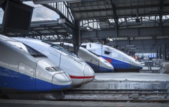 Four different types of high-speed modern trains, stationed in the train station from Paris,
