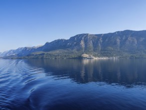Mountain range by the sea in the morning light, panoramic shot, Makarska Riviera, near Makarska,