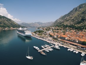 Top view of the pier with a big boat and town. Drone photo