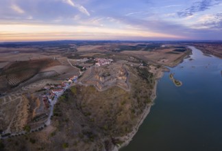 Juromenha castle, village and Guadiana river drone aerial view at sunset in Alentejo, Portugal,