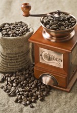 Coffee beans in bag and coffee mill