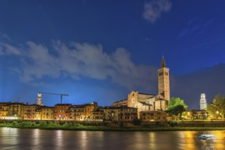 Verona Italy, night city skyline at Adige river and Basilica di Santa Anastasia