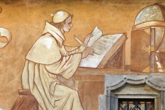 Writing monk. Painting on a house Austria