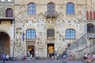 The fascinating facade of Palazzo Nuovo del Podesta on the Piazza del Duomo in San Gimignano,