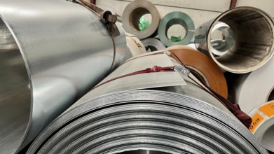 Rolls of galvanized steel sheet inside the factory or warehouse