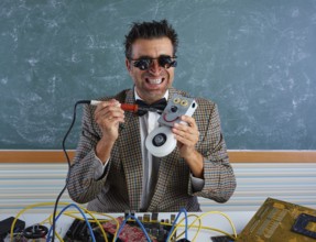 Nerd electronics technician silly retro teacher welding self made robot
